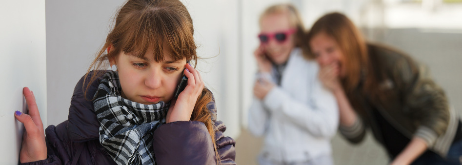 Teen being bullied by two other teen girls