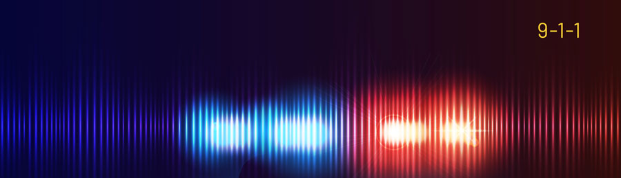 9-1-1 text over blue and red emergency lights blurred